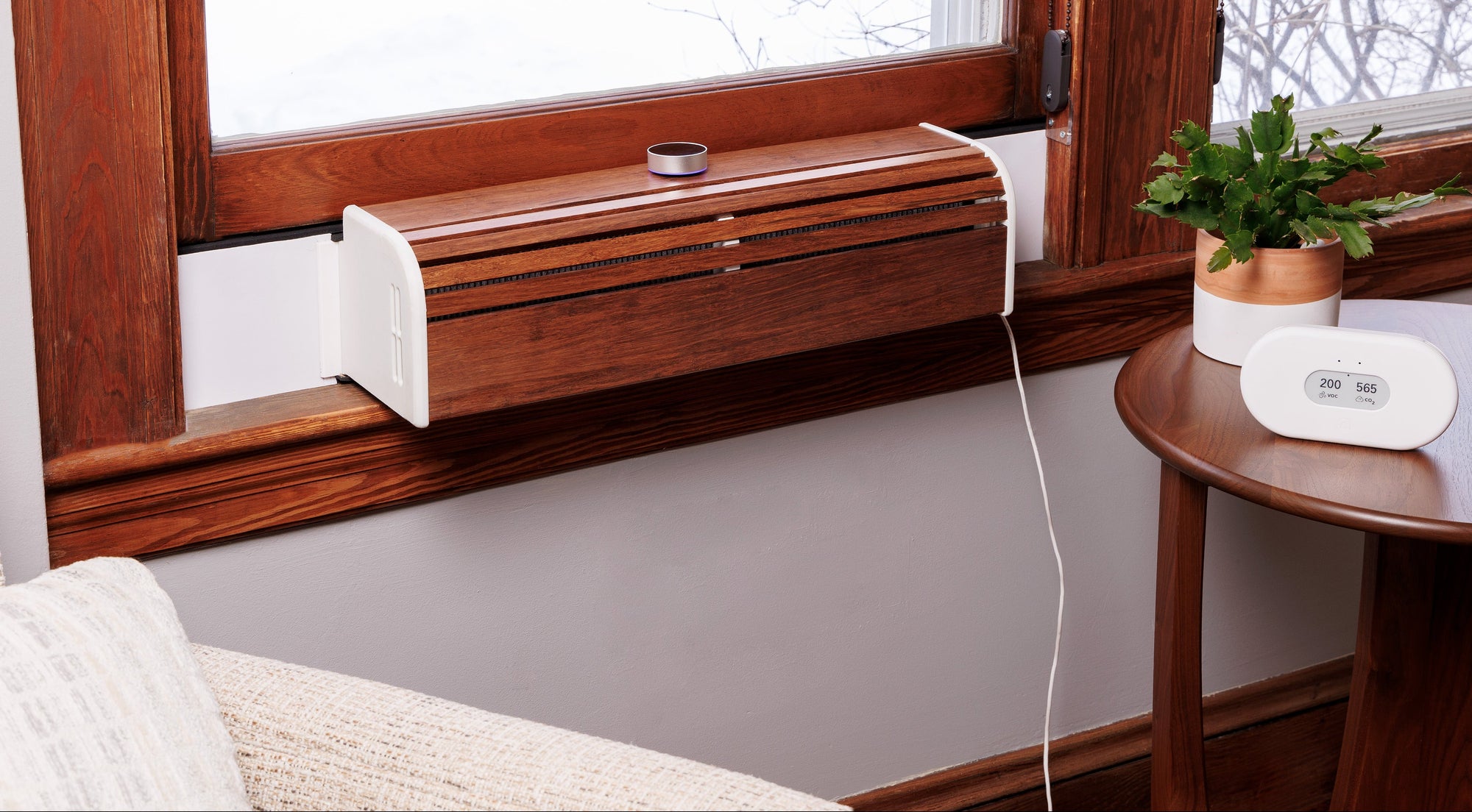 SWERV Window Mounted ERV Installed into beautiful wooden window in bedroom or living room. Air quality sensor Airthings and plant. Fresh air without opening window