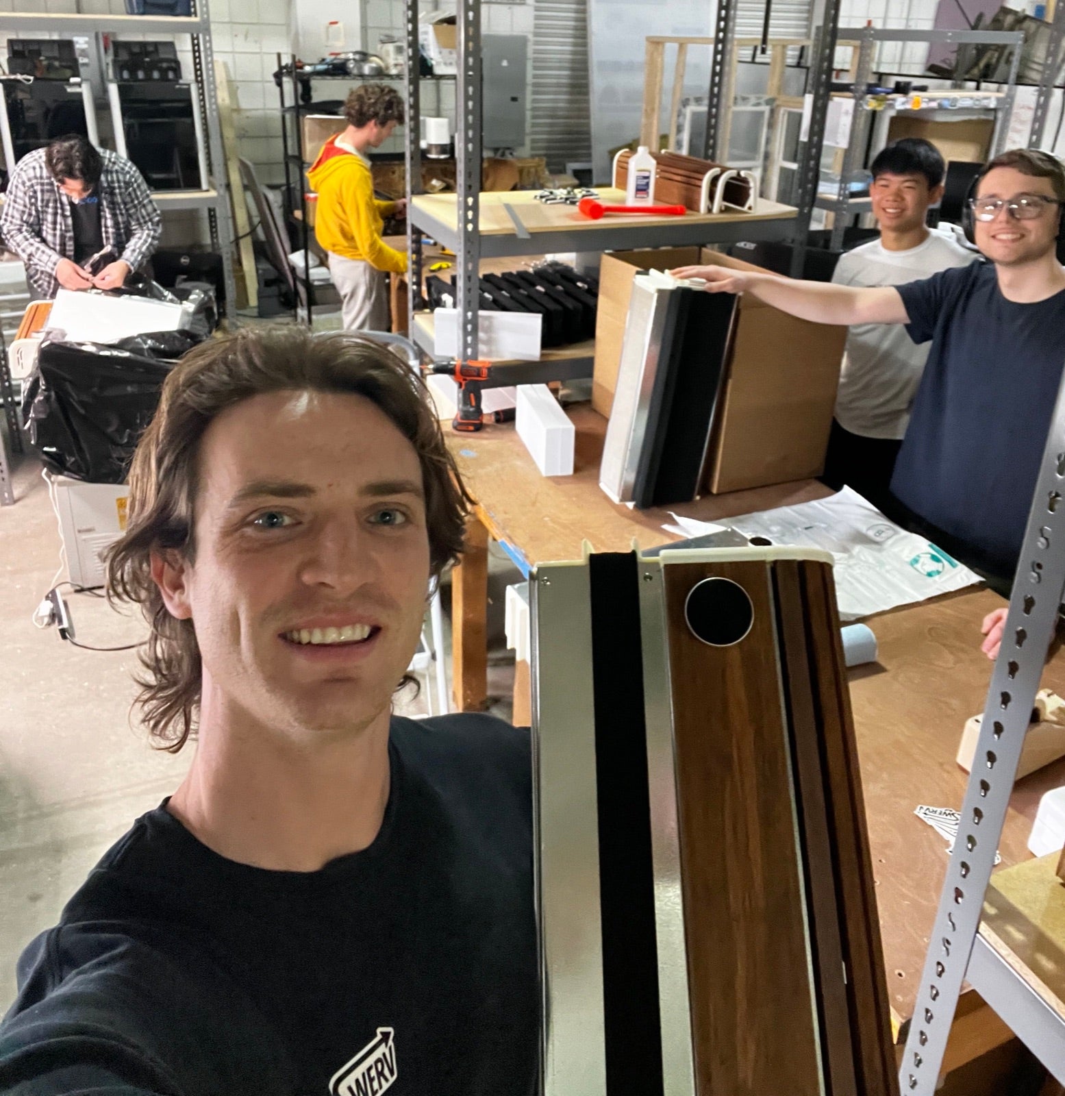 Founder Austin at the SWERV lab, building the fresh-air machines that lower indoor CO2